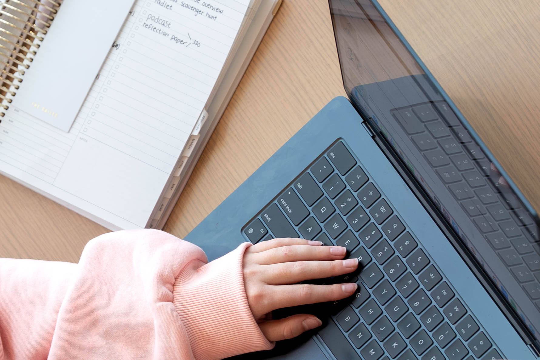 Hands on a laptop typing